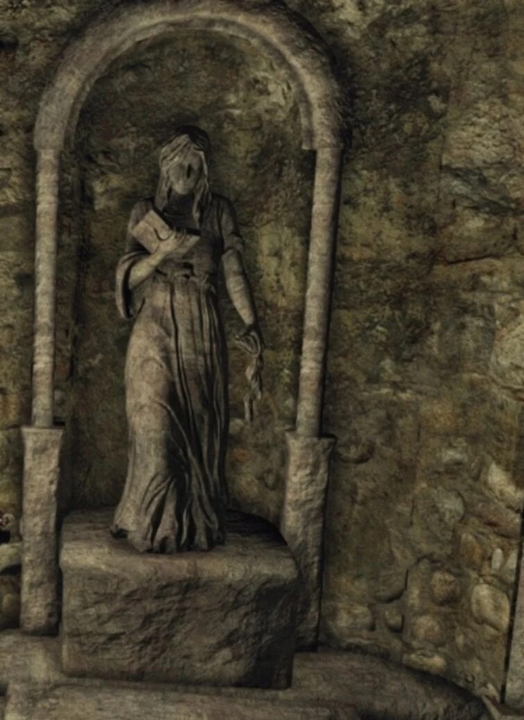 Статуя держит в руке талисман Велки в левой руке, в правой держит Книгу Виновных — книгу Велки, что содержит список грешников, которых должны покарать Клинки Темной Луны. Рядом с этой статуей служитель Велки — Кромвель.